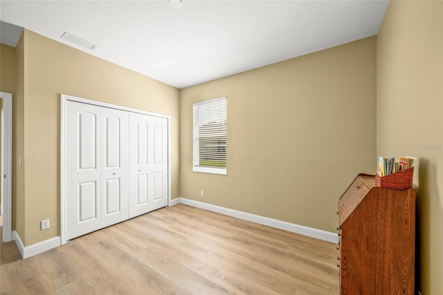9106 Yarberry St, Sarasota, FL 34240 - unfurnished bedroom with baseboards, visible vents, and light wood-style floors