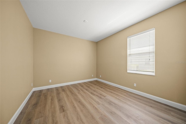 9106 Yarberry St, Sarasota, FL 34240 - unfurnished room with baseboards and light wood-style floors