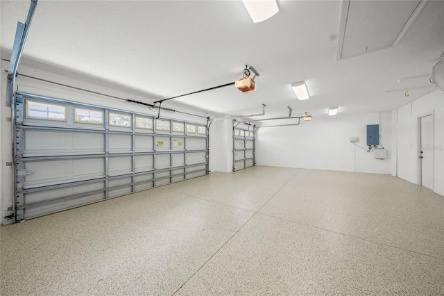 9106 Yarberry St, Sarasota, FL 34240 - garage with electric panel and a garage door opener