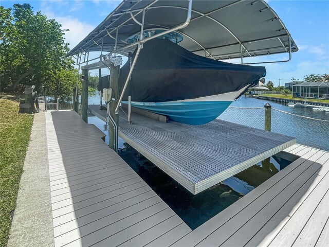 dock area featuring a water view and boat lift