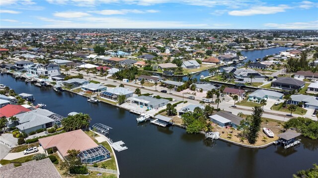bird's eye view with a water view and a residential view