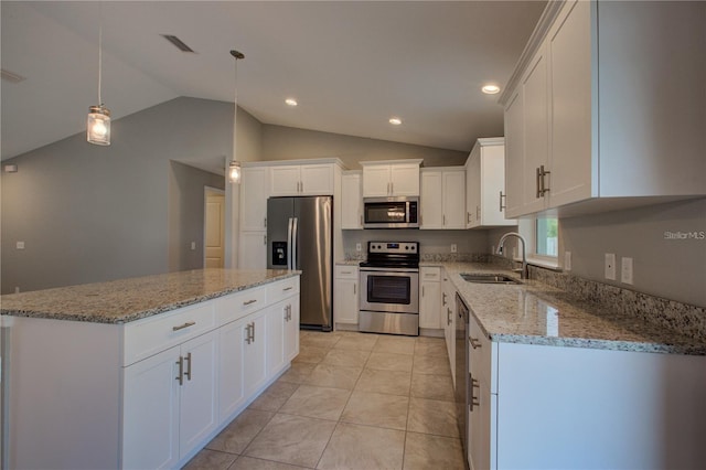 25 Sabot Ct, Placida, FL 33946 - kitchen with a sink, stainless steel appliances, a center island, visible vents, and lofted ceiling