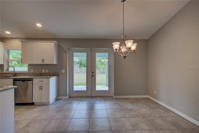 25 Sabot Ct, Placida, FL 33946 - kitchen with a wealth of natural light, french doors, dishwasher, and baseboards