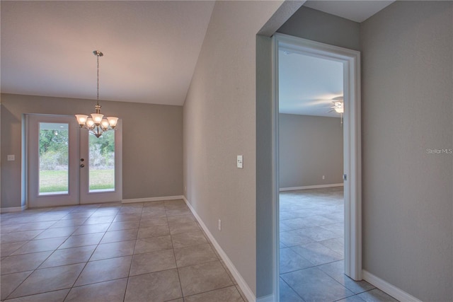 25 Sabot Ct, Placida, FL 33946 - interior space with light tile patterned flooring, a notable chandelier, and baseboards