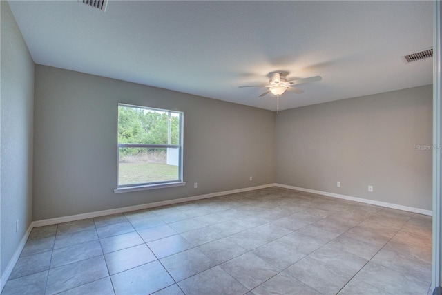25 Sabot Ct, Placida, FL 33946 - unfurnished room with baseboards, visible vents, light tile patterned floors, and ceiling fan