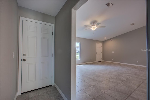 25 Sabot Ct, Placida, FL 33946 - entrance foyer with light tile patterned floors, visible vents, a ceiling fan, and baseboards