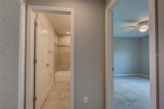 25 Sabot Ct, Placida, FL 33946 - hallway with light tile patterned floors and a textured wall