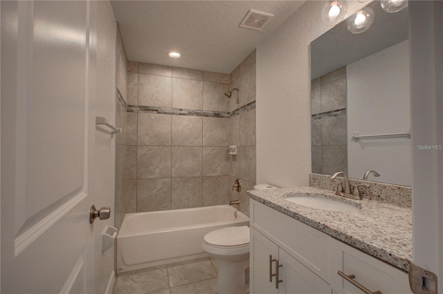 25 Sabot Ct, Placida, FL 33946 - full bath featuring tile patterned flooring, toilet, vanity, visible vents, and tub / shower combination