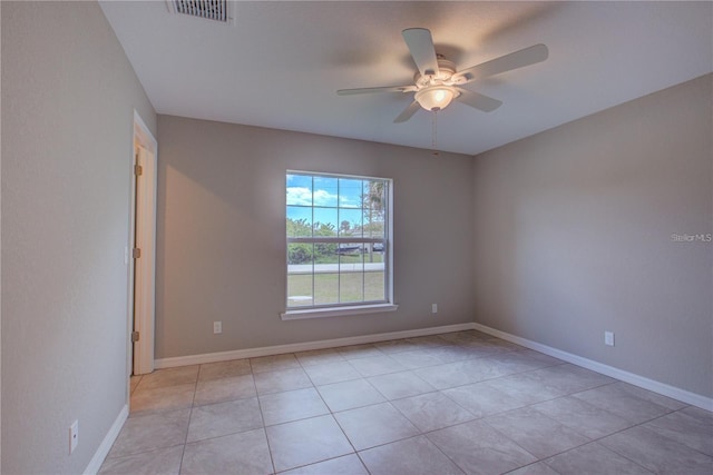 25 Sabot Ct, Placida, FL 33946 - empty room featuring light tile patterned floors, visible vents, ceiling fan, and baseboards