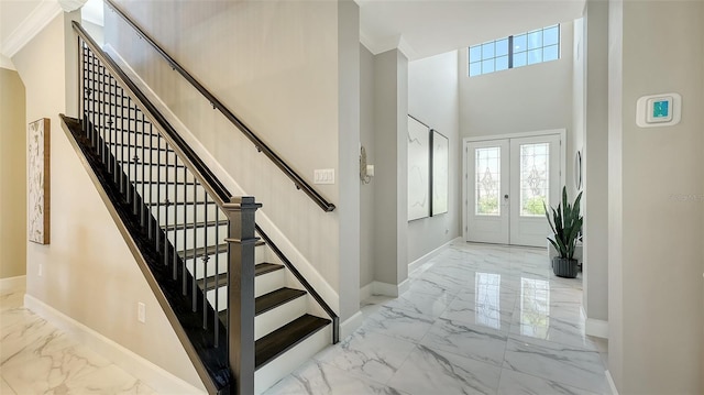 7889 Mainsail Ln, Sarasota, FL 34240 - entrance foyer with marble tiled floors, baseboards, plenty of natural light, and a high ceiling