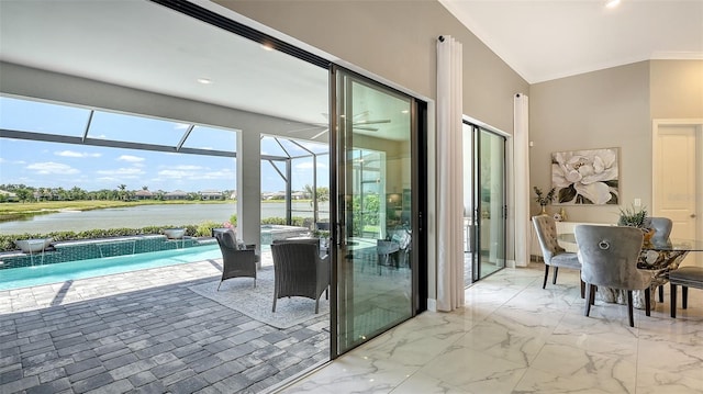 7889 Mainsail Ln, Sarasota, FL 34240 - entryway with a sunroom, a water view, ornamental molding, marble finish floors, and recessed lighting