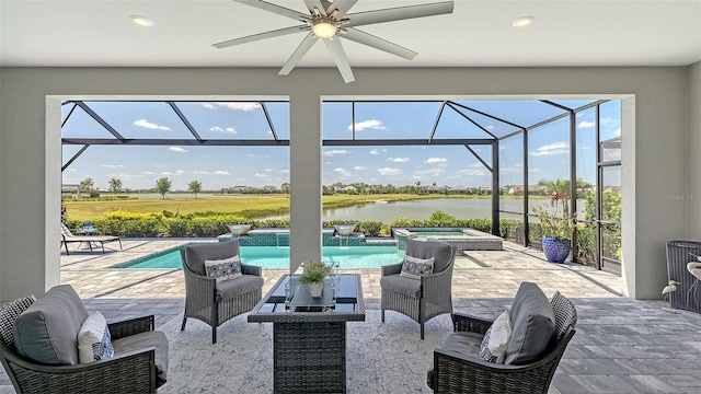 7889 Mainsail Ln, Sarasota, FL 34240 - view of patio featuring a water view, ceiling fan, glass enclosure, and an outdoor hangout area