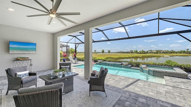 7889 Mainsail Ln, Sarasota, FL 34240 - view of patio with a water view, a ceiling fan, a pool with connected hot tub, outdoor lounge area, and glass enclosure