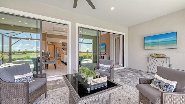 7889 Mainsail Ln, Sarasota, FL 34240 - view of patio / terrace featuring an outdoor living space, a ceiling fan, and a water view