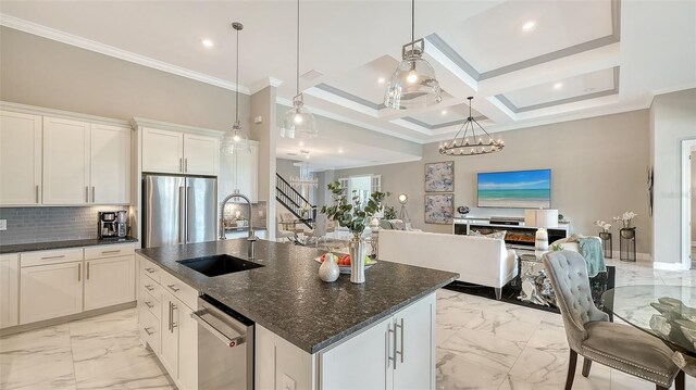7889 Mainsail Ln, Sarasota, FL 34240 - kitchen with a sink, appliances with stainless steel finishes, light marble finish floors, crown molding, and open floor plan
