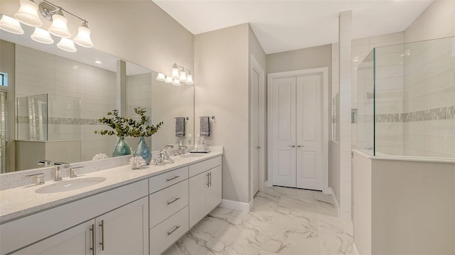 7889 Mainsail Ln, Sarasota, FL 34240 - bathroom featuring walk in shower, marble finish floors, double vanity, and baseboards