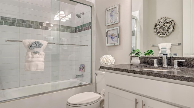 7889 Mainsail Ln, Sarasota, FL 34240 - bathroom featuring toilet, vanity, and shower / bath combination with glass door