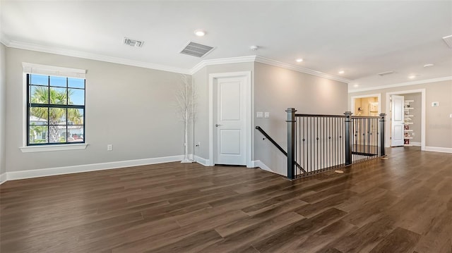 7889 Mainsail Ln, Sarasota, FL 34240 - empty room featuring dark wood-type flooring, baseboards, recessed lighting, and crown molding
