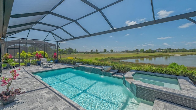 7889 Mainsail Ln, Sarasota, FL 34240 - view of pool with a patio, a water view, a lanai, and a pool with connected hot tub