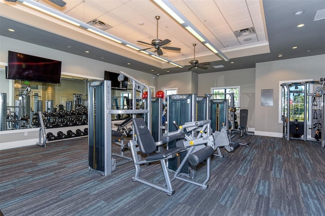 7889 Mainsail Ln, Sarasota, FL 34240 - workout area featuring carpet, ceiling fan, a raised ceiling, and baseboards