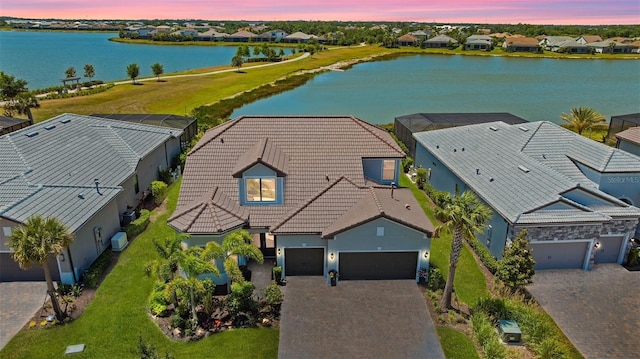 7889 Mainsail Ln, Sarasota, FL 34240 - aerial view at dusk of a water view and a residential view