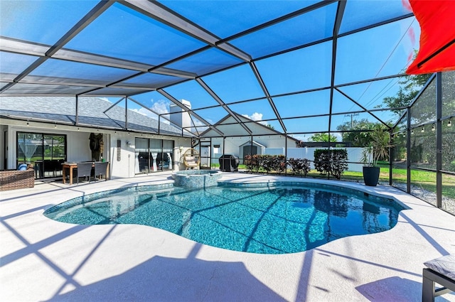 view of pool with a patio, a pool with connected hot tub, and a lanai
