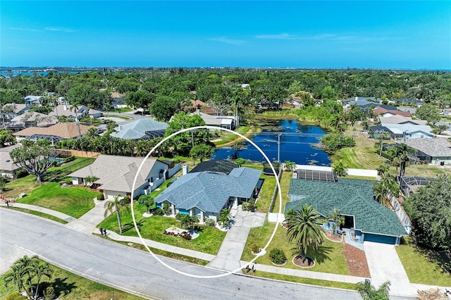 bird's eye view with a residential view and a water view