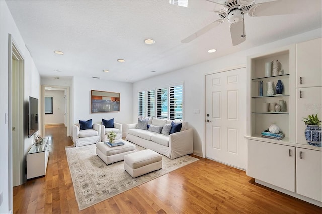 2918 Avenue Ave E, Holmes Beach, FL 34217 - living area featuring light wood-type flooring, ceiling fan, recessed lighting, and built in shelves
