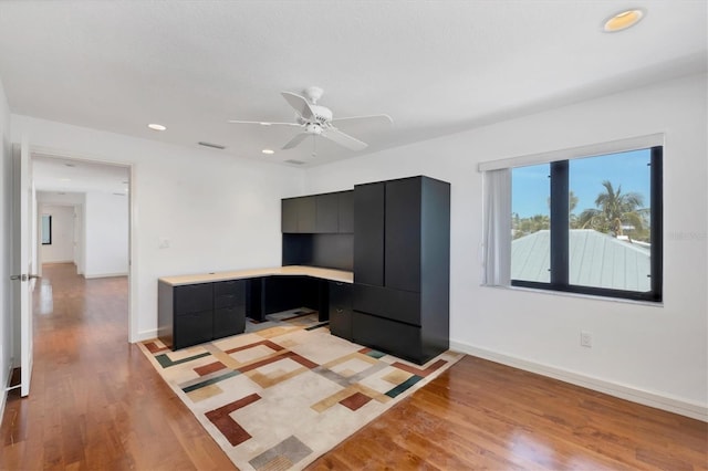 2918 Avenue Ave E, Holmes Beach, FL 34217 - unfurnished living room featuring light wood finished floors, a ceiling fan, recessed lighting, and built in desk