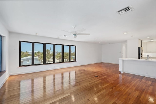 2918 Avenue Ave E, Holmes Beach, FL 34217 - unfurnished living room with light wood-type flooring, recessed lighting, and ceiling fan