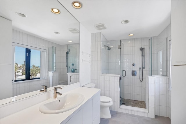 2918 Avenue Ave E, Holmes Beach, FL 34217 - full bathroom with vanity, a shower stall, recessed lighting, tile patterned floors, and tile walls