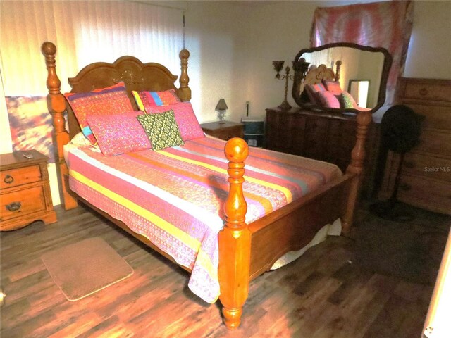 9835 El Camino Real Ave, Port Richey, FL 34668 - bedroom featuring wood finished floors