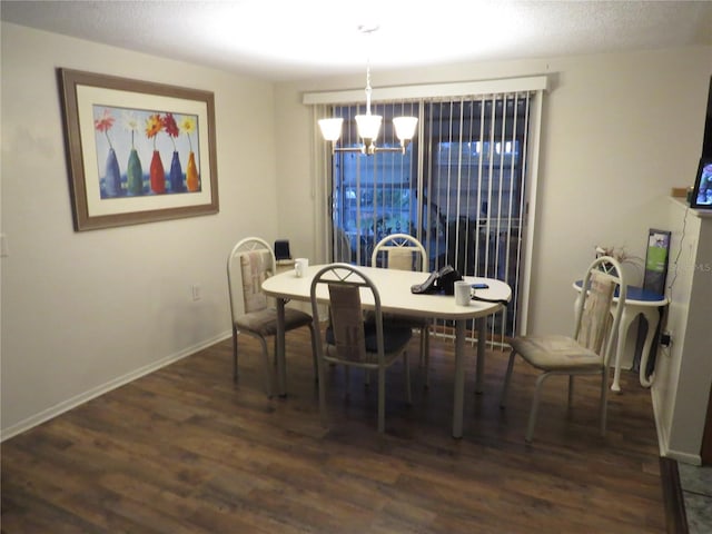 9835 El Camino Real Ave, Port Richey, FL 34668 - dining room featuring a chandelier, wood finished floors, and baseboards