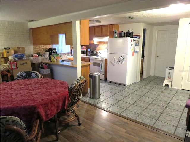 9835 El Camino Real Ave, Port Richey, FL 34668 - dining area with light wood-style floors