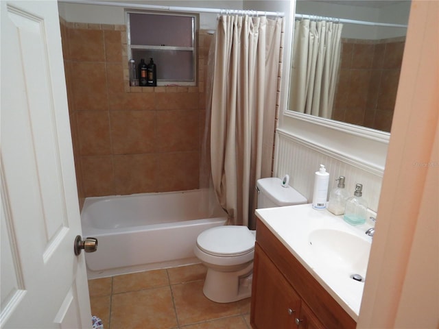 9835 El Camino Real Ave, Port Richey, FL 34668 - full bathroom with tile patterned floors, toilet, vanity, and shower / bath combo