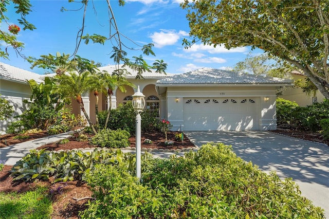 4180 Via Mirada, Sarasota, FL 34238 - ranch-style home with stucco siding, concrete driveway, and a garage