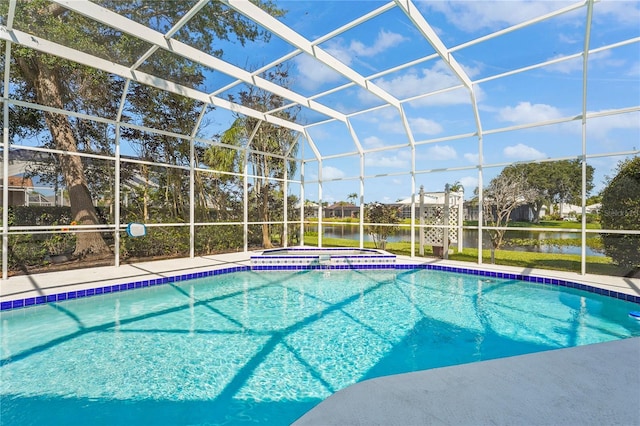 4180 Via Mirada, Sarasota, FL 34238 - view of swimming pool with a pool with connected hot tub, a lanai, and a water view