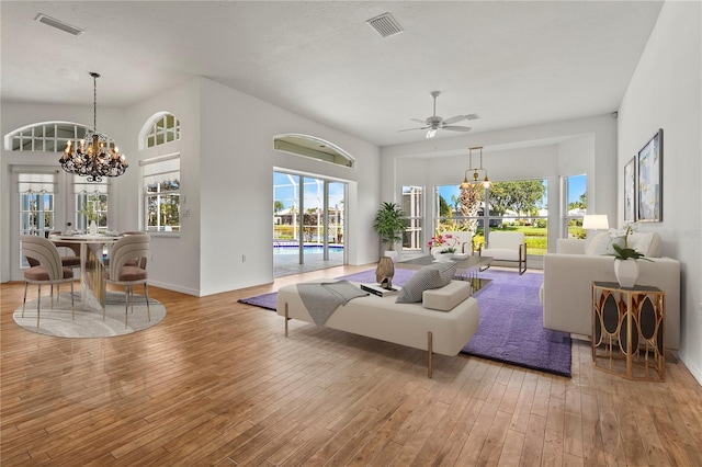 4180 Via Mirada, Sarasota, FL 34238 - living room featuring a chandelier, hardwood / wood-style flooring, and plenty of natural light