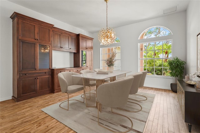 4180 Via Mirada, Sarasota, FL 34238 - dining room featuring light wood finished floors, a chandelier, and baseboards