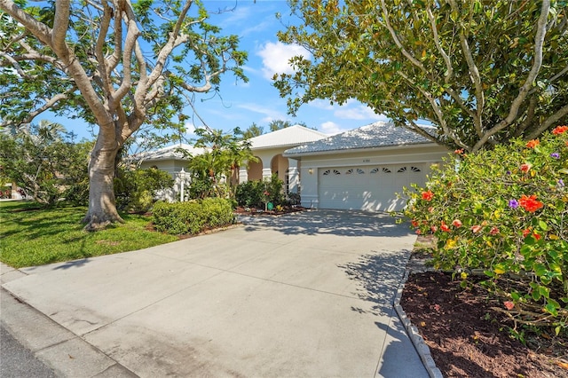 4180 Via Mirada, Sarasota, FL 34238 - ranch-style home featuring a garage, stucco siding, and driveway