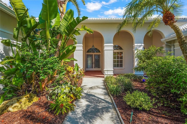 4180 Via Mirada, Sarasota, FL 34238 - entrance to property with french doors, stucco siding, and covered porch