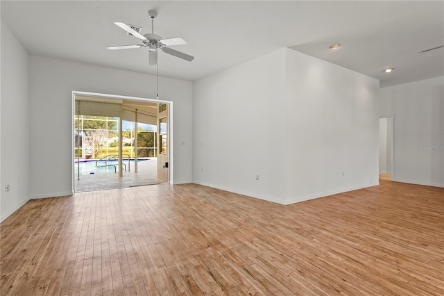 4180 Via Mirada, Sarasota, FL 34238 - empty room with light wood finished floors, a ceiling fan, and baseboards