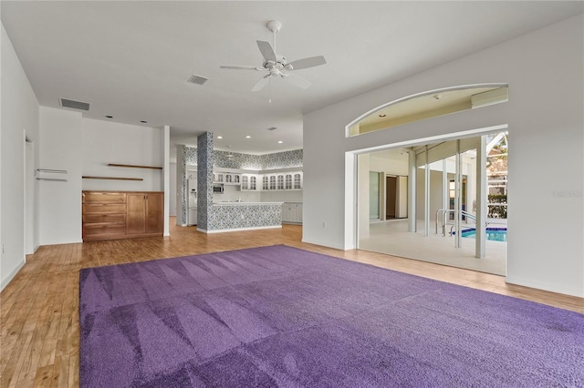 4180 Via Mirada, Sarasota, FL 34238 - unfurnished living room featuring a ceiling fan, wood finished floors, and baseboards