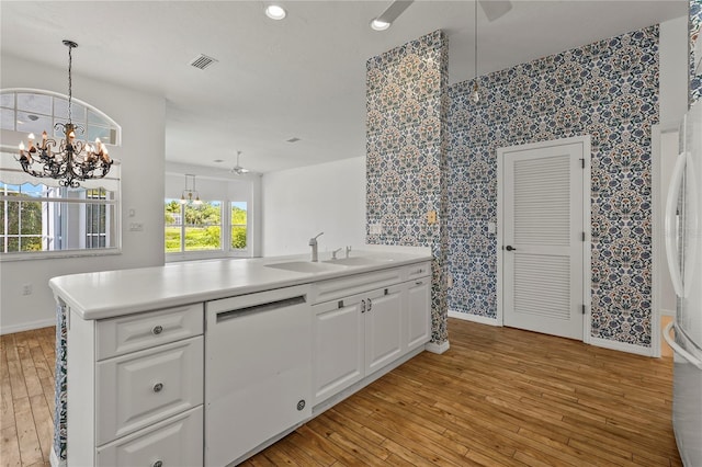 4180 Via Mirada, Sarasota, FL 34238 - kitchen featuring ceiling fan, baseboards, light wood finished floors, wallpapered walls, and recessed lighting