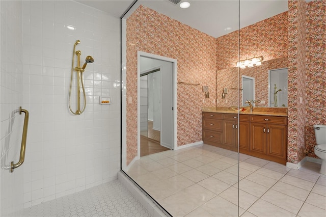 4180 Via Mirada, Sarasota, FL 34238 - full bathroom featuring a tile shower, vanity, tile patterned flooring, toilet, and wallpapered walls