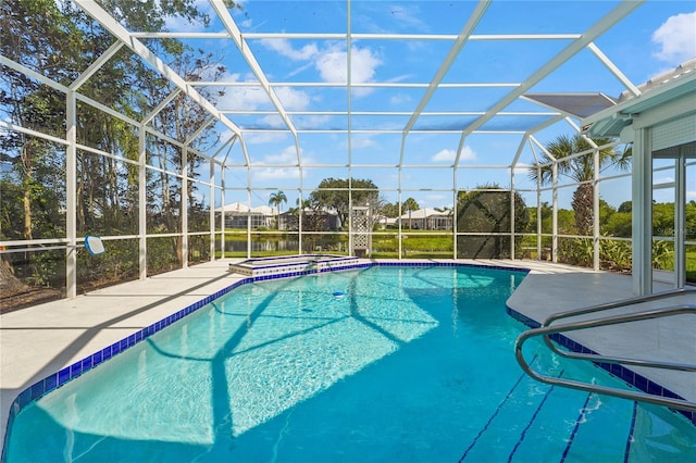 4180 Via Mirada, Sarasota, FL 34238 - view of pool featuring glass enclosure, a pool with connected hot tub, and a patio