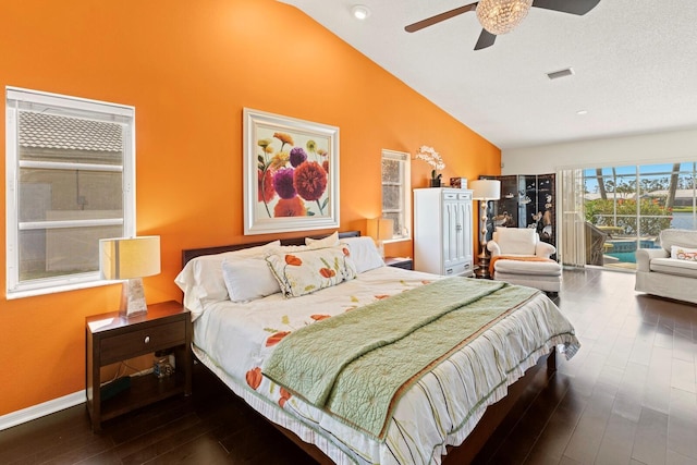 bedroom featuring dark wood-style flooring, high vaulted ceiling, access to exterior, baseboards, and visible vents