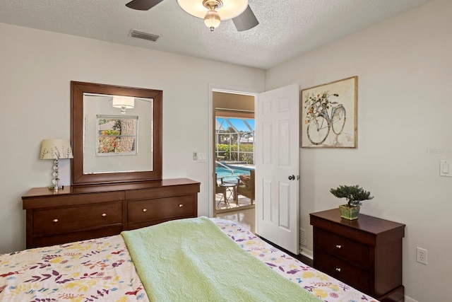bedroom featuring access to outside, ceiling fan, a textured ceiling, baseboards, and visible vents