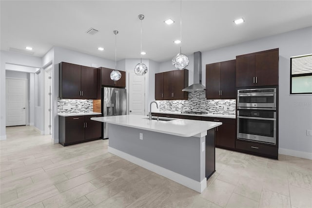 8229 Grande Shores Dr, Sarasota, FL 34240 - kitchen featuring wall chimney exhaust hood, a sink, stainless steel appliances, light countertops, and backsplash