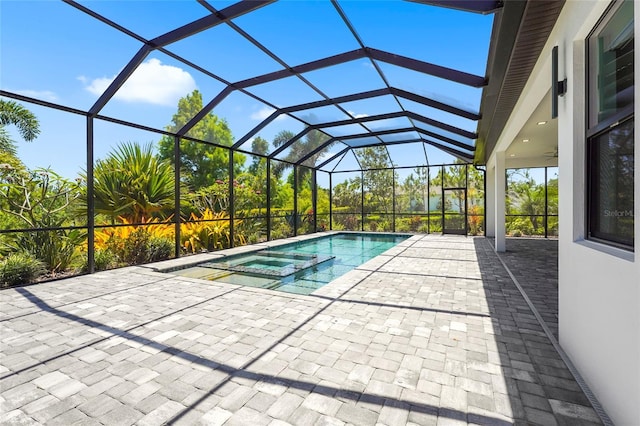 8229 Grande Shores Dr, Sarasota, FL 34240 - view of pool with a pool with connected hot tub, a patio area, and glass enclosure